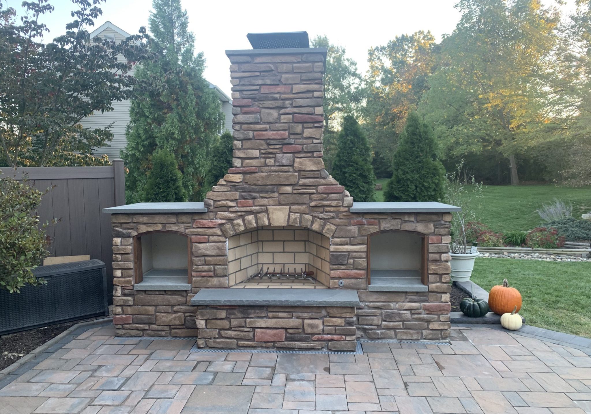 A larger, more permanent fire feature is a fireplace. This is a Mezzo fireplace on a patio.